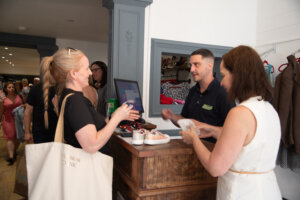 woman paying for goods in Winchester pre-loved boutique