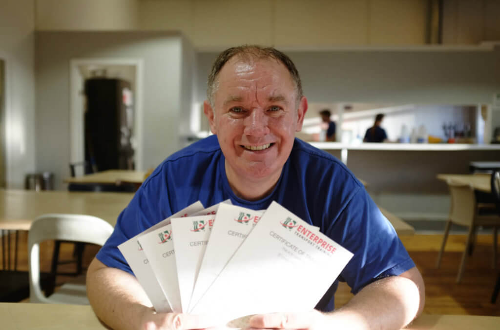 Simon with his driving certificates