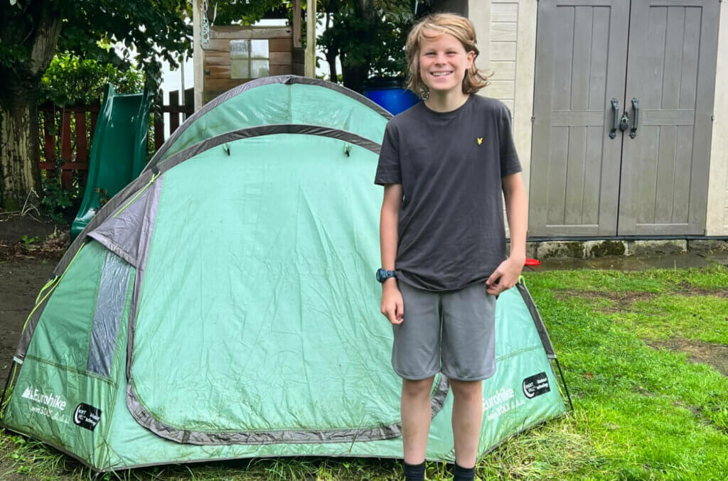 Billy stood next to his tent